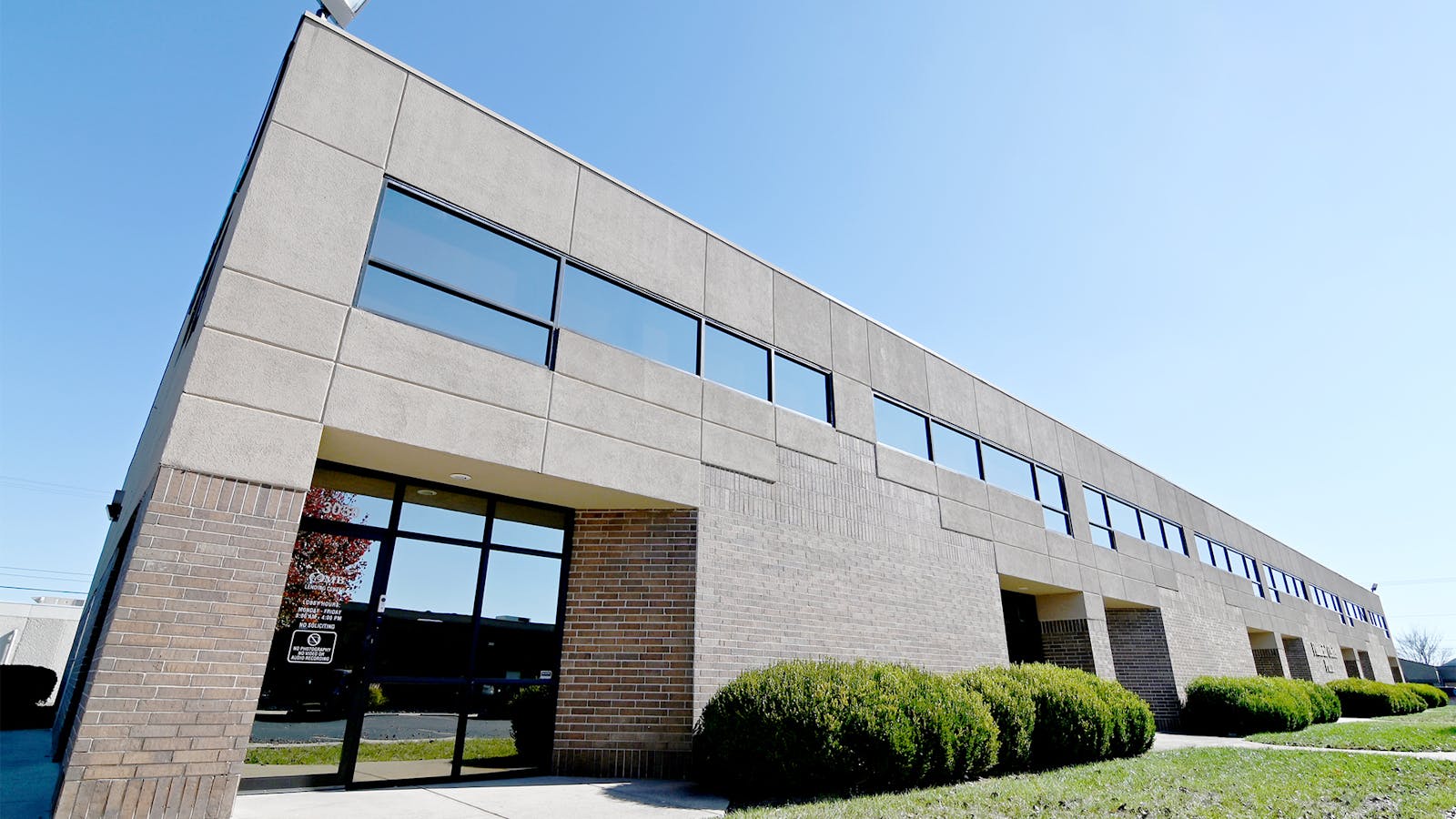 Exterior image of lending center brown brick and stucco facade