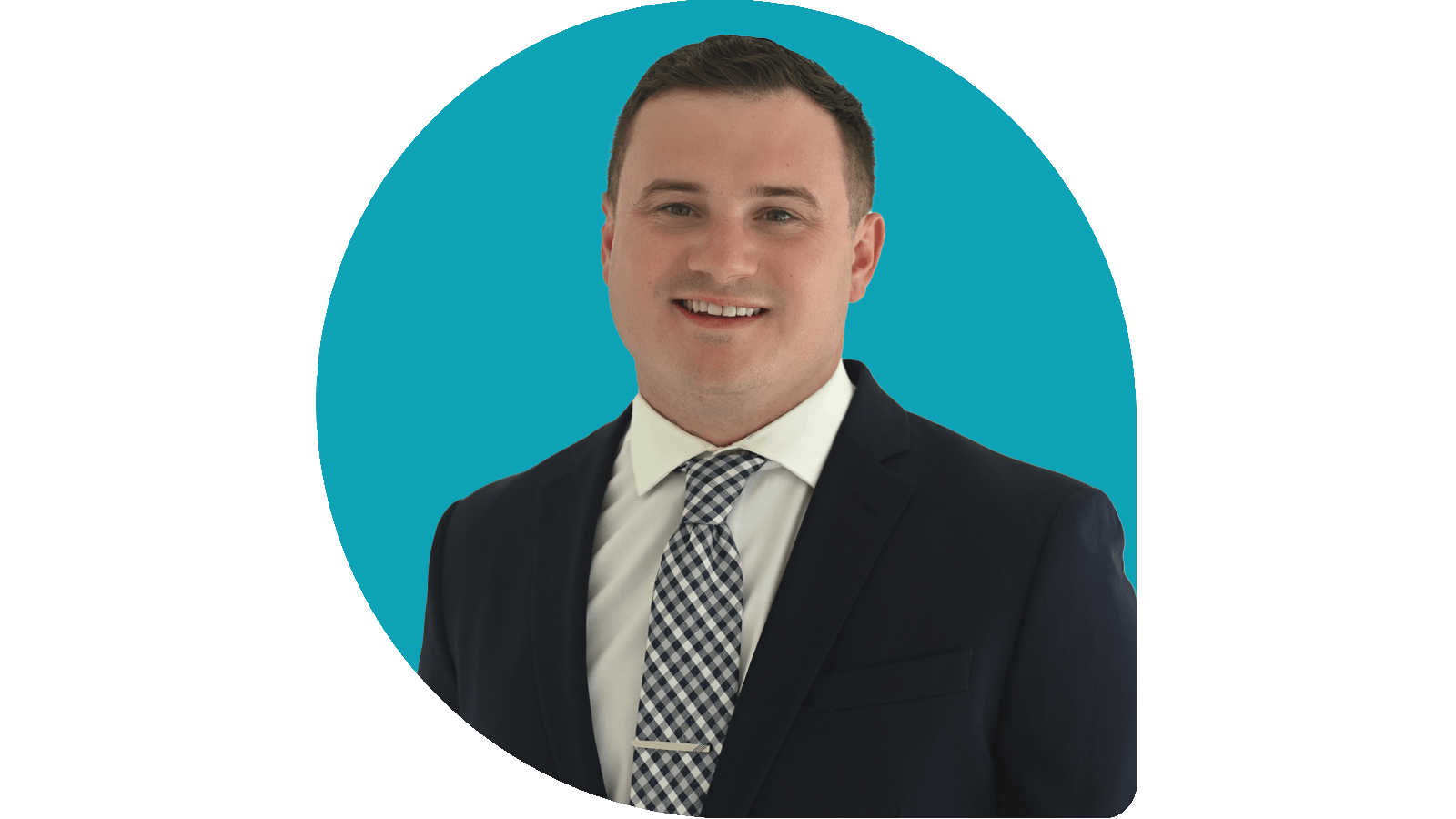 Isaac Lasater in navy suit on teal drop background