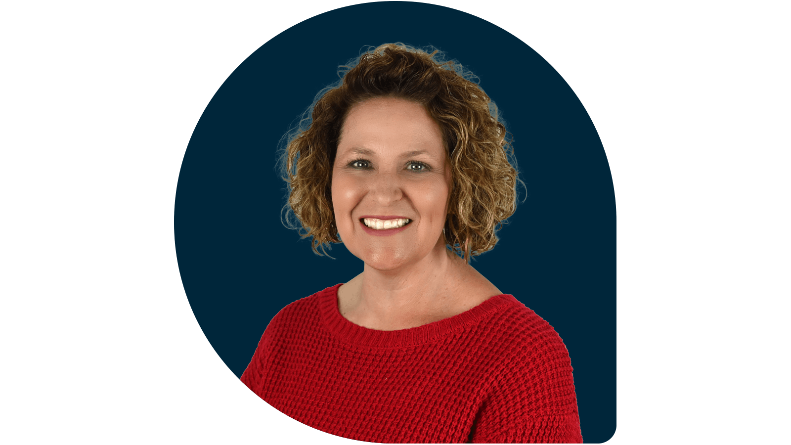 Robin Rees in red sweater on navy drop background