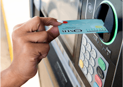 Someone is using their OMB Stock Reward debit card at an ATM