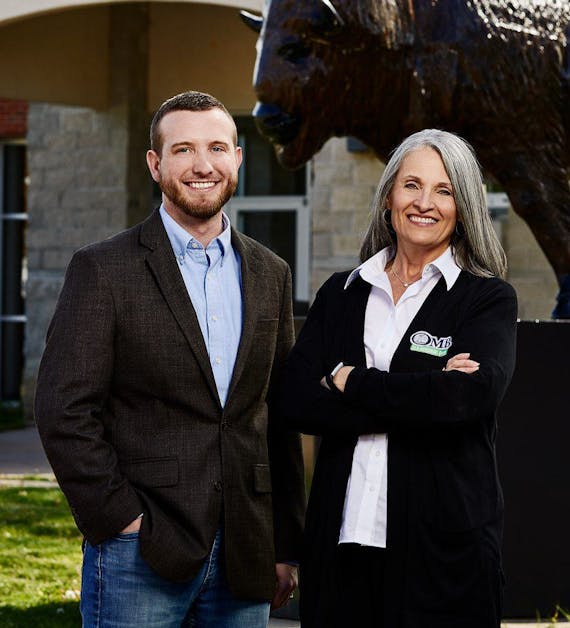 Austin Mooneyham and Penny Morgans standing in front of Buffalo High School